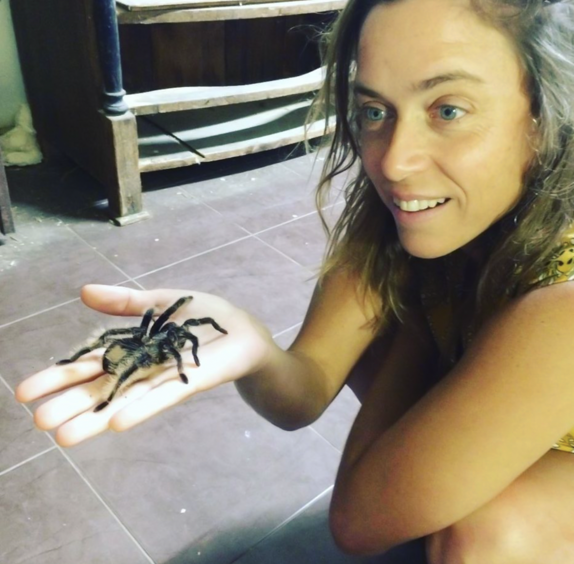 Inbal holding a large spider